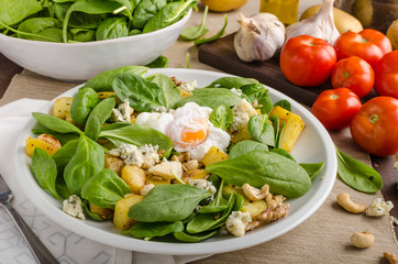 Spinach salad with egg benedict