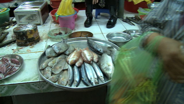 CU pan fish for sale on counter at market