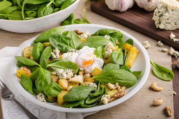 Spinach salad with egg benedict