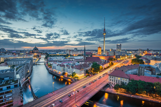 Berlin skyline with dramatic clouds in twilight at dusk, Germany