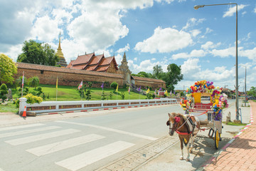 Thailand tradition Carriage with beautiful temple (Wat Prathat L