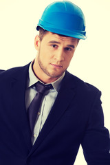 Happy businessman with blue hard hat.