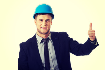 Happy smiling businessman with thumbs up.