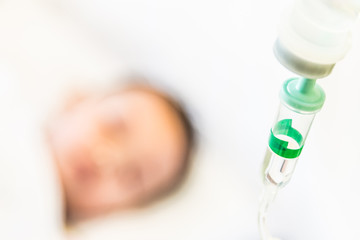 Naklejka premium Selective focus point saline IV drip for patient