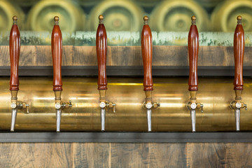 Beer taps inside a pub - 91800188