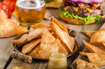 Homemade nachos with rustic burger