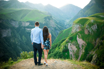 Fototapeta na wymiar beautiful young couple in love in the mountains