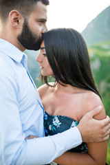 beautiful young couple in love in the mountains