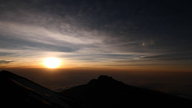 Setting sun with rocky outcrop