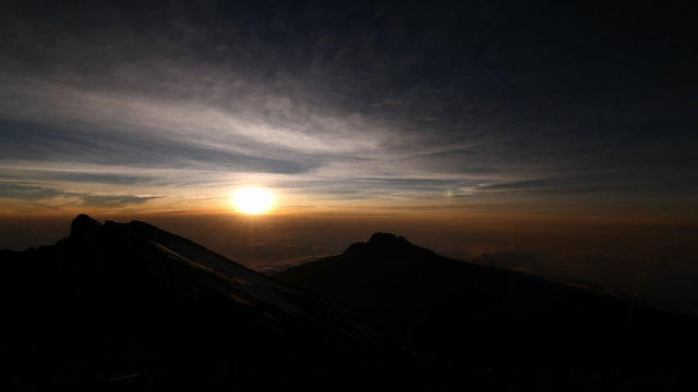 Setting sun with rocky outcrop