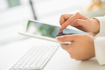 Hands of an office woman typing keyboard with credit card