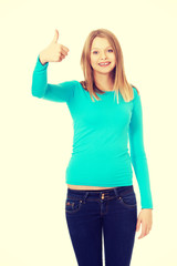 Happy female student showing thumbs up