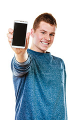 Young man showing black blank phone screen