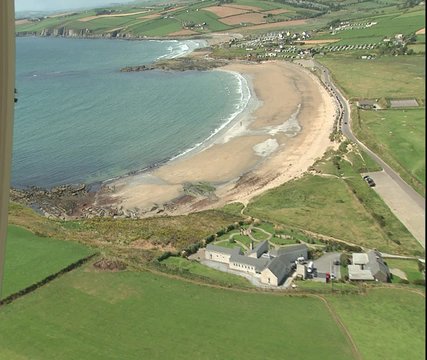 Aerial WS nearly deserted Irish beach