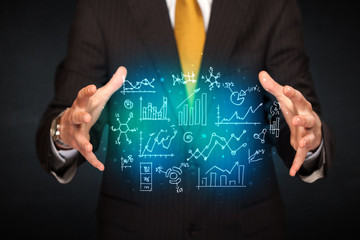 holding hand drawn business diagrams