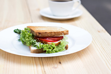 Healthy ham sandwich with cheese, tomatoes and lettuce