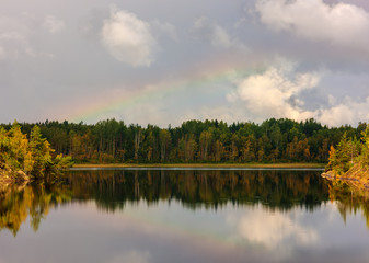 forest lake with rainbow