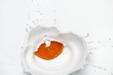 orange in milk splash