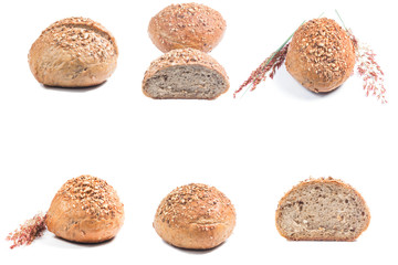 Fresh whole grain bread cut in half on white background
