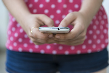 Teenage girl using mobile smart phone