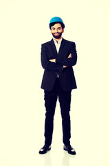 Handsome engineer in protective helmet.