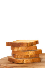 Tower of crunchy bread toast on the wooden board