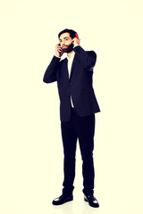 Businessman listening to music.