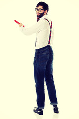 Old fashioned man pointing with big pencil.