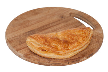 Pizza pastry half on the wooden board