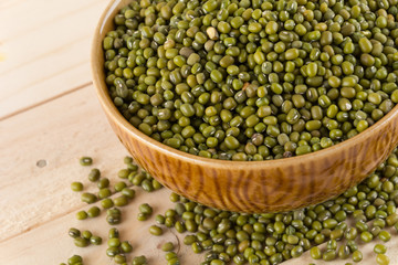 green beans on wood background