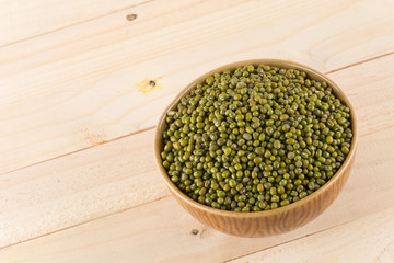 green beans on wood background