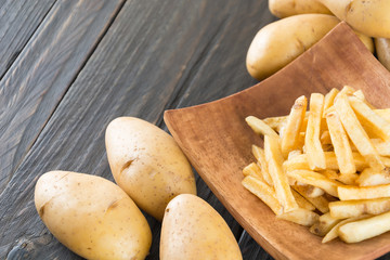 french fries on wood background
