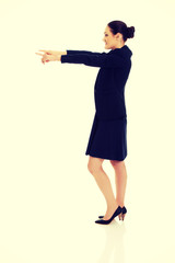 Businesswoman pointing on empty space.