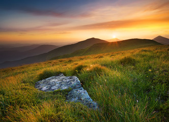Bright sunset in mountain in summer time. Beautiful natural landscape