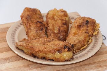 Fried paprika stuffed with cheese and served