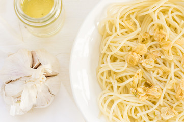 Dish of spaghetti with garlic and olive oil