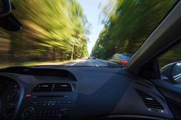 Driving in good weather conditions, overtaking - obrazy, fototapety, plakaty