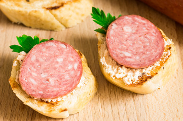 Tasty appetizer with salami cervelat
