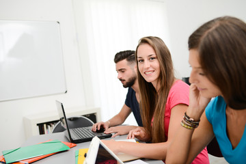 portrait of beautiful young girl student in high school university classroom