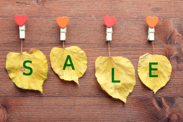 yellow leaves on wooden background