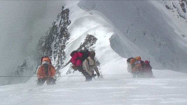 Sherpas and Climbers in heavy winds