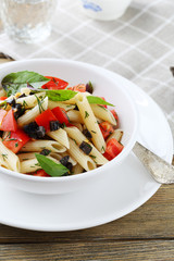 pasta with tomatoes and olive slice