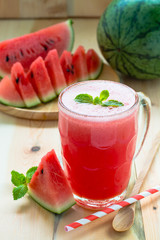 Watermelon smoothie on a rustic wood table background, Iced wate