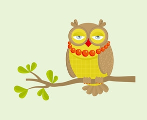 The portrait of fashionable owl on the branch.
