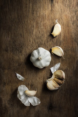 Organic garlic bulbs on rustic wooden background, Still life pho