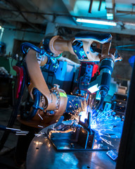 Manufacturing. Robotic machine welding metal