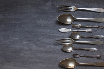 antique cutlery on wooden background