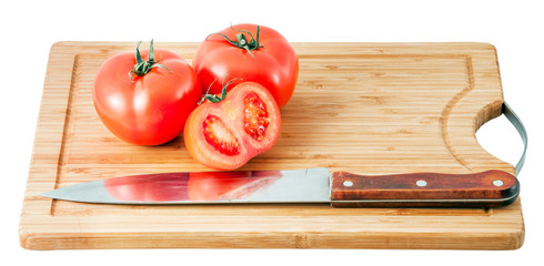 tomatoes on a cutting board isolated on a white background