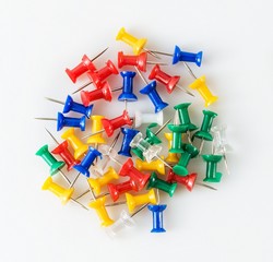 thumbtacks on white background