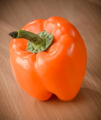 Fresh red peppers on a cutting board